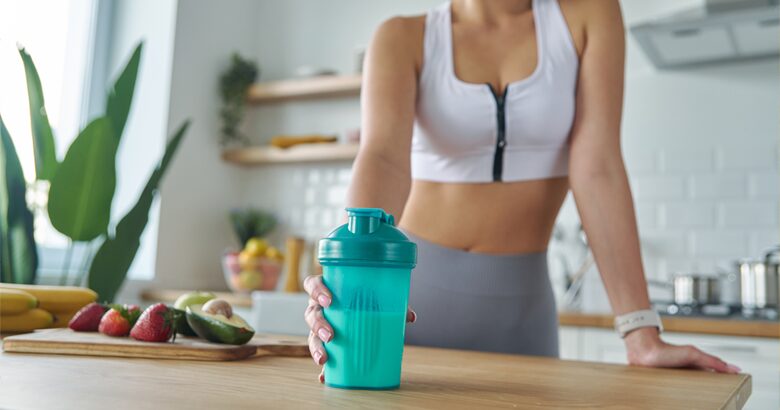 woman with post workout shake
