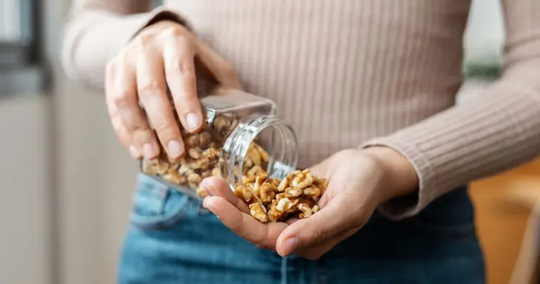 Woman with heart healthy nuts