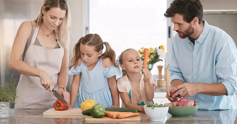 Family cooking with vegetables